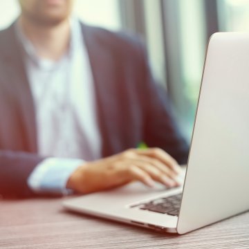 man on laptop mac utilities